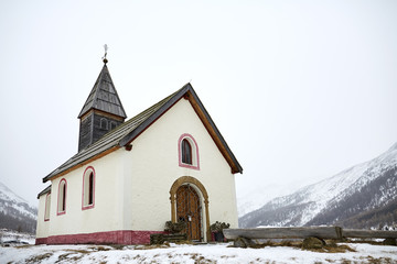 Fototapeta na wymiar Old church in the snow. Church at the foot of the glacier. Maso Corto, Sudtirol, Bolzano, Alps, Italy. Maso Corto church