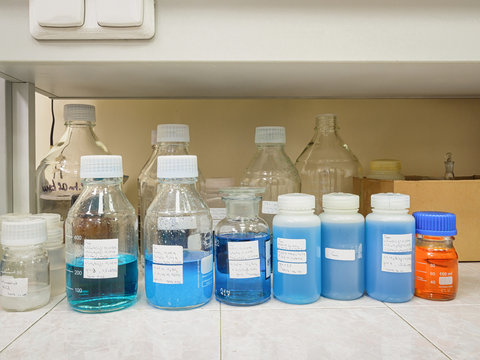 Blue solution in chemical containers in a chemical laboratory