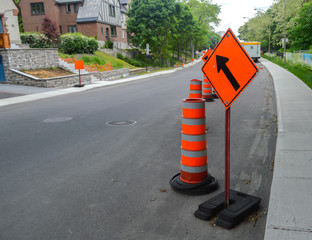 The orange traffic cone on the sidewalk in Montreal downtown, Canada