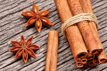 Heap of cinnamon sticks with anise star