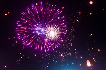 Colorful fireworks light up the sky with lantern Yi Peng Festival, Chiangmai Thailand