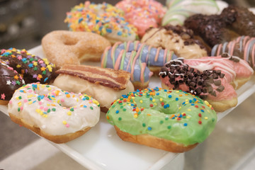Donuts spell out the message Happy Birthday on a plate