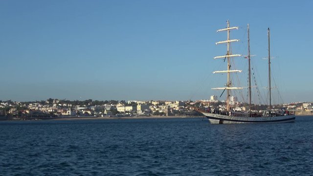 Sailing ship entering a harbor