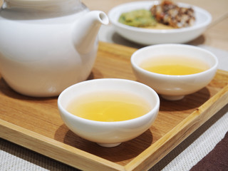 Obraz na płótnie Canvas Chinese tea set with refreshments on the table