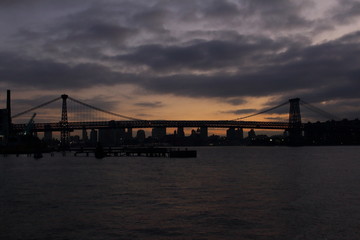 bridge over a river at sunset