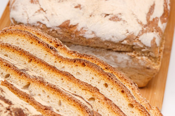 Slices of fresh baked traditional loaf of rye bread