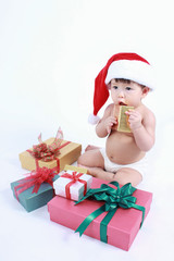  Asian baby girl with christmas dressing and present box isolated on white background