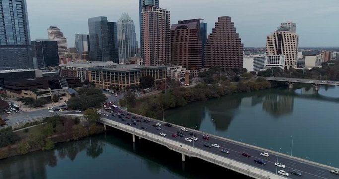AUSTIN, TX - Circa December, 2017 - An aerial establishing shot of traffic passing over the South 1st Street Bridge over the Colorado River in Austin, Texas.  	