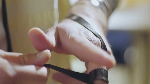 Jewish man put on  the hand a tefillin