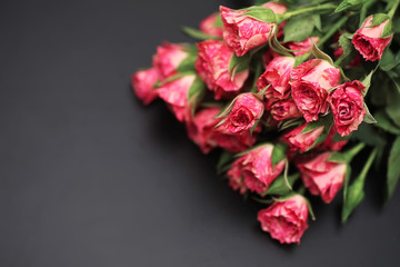 Bouquet of red roses on a black matte background