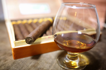 Large box of Cuban cigars on a wooden table
