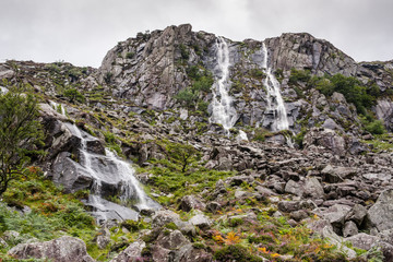 Waterfalls running down rock walls in Ireland. 