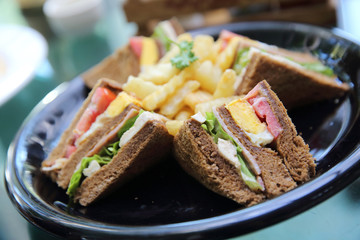 Club sandwich , Sandwich with chicken tomato chicken bacon and vegetable