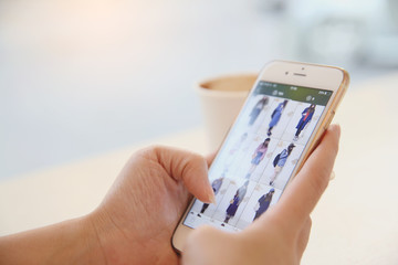 Asian female hands shopping online with smartphone