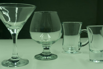cocktail Martini with utensils on a black background.