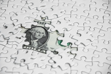 Missing jigsaw puzzle pieces on money dollar background, Business solution concept ,key for success