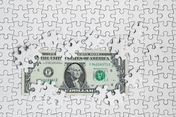 Missing jigsaw puzzle pieces on money dollar background, Business solution concept ,key for success
