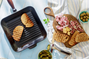 Italian snacks Bruschetta on blue wooden table Lunch table concept