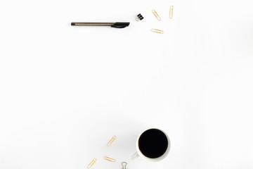 Workspace pattern with coffee, pen, golden clips on white background