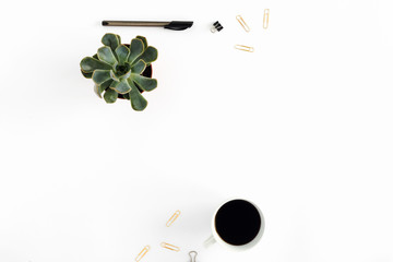 Workspace pattern with coffee, succulent, pen, golden clips. flat lay