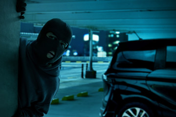 Masked thief hiding
