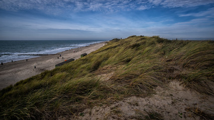Fototapeta na wymiar Beautiful view on sandy dunes and blue cloudy sky near Vlissingen, Zeeland, Holland, Netherlands