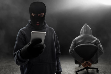 Masked thief threatening