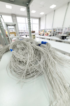 A bundle of white insulated wire on the rack. 