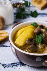 Transparent soup with oyster mushrooms