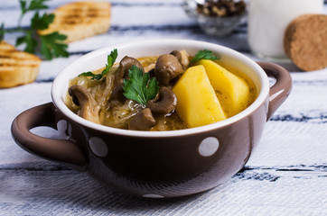 Transparent soup with oyster mushrooms
