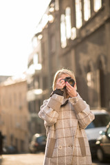 Fototapeta premium Professional photographer in the city or a tourist woman