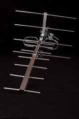 Yagi Uda antenna for UHF tv isolated on the black background