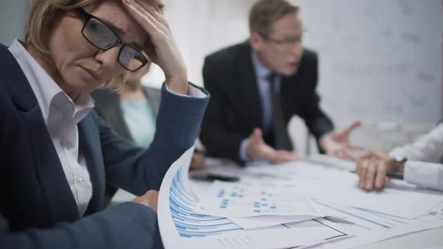 Woman consultant feeling stress at the meeting, occupational burnout, overworked