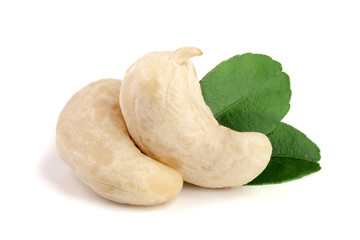 cashew nuts with leaf isolated on white background. macro