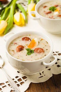 Traditional Polish white borsch with Easter decoration