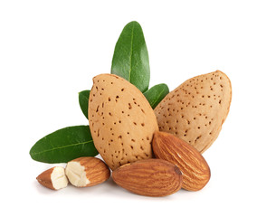 Group of almond nuts with leaves isolated on white background