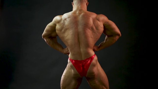 bodybuilder posing in studio