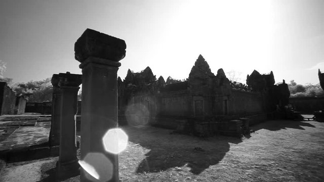 Wide dolly motion moving acrosss the interior of Banteay Srei in Angkor Wat Archeological Park.
