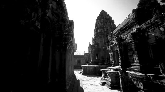 Steadicam gimbal through the may still standing ruins of Banteay Strei temple in Angkor Wat Archeological Park.