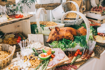 Meat, cheese and nutmeg wedding buffet with various snacks.