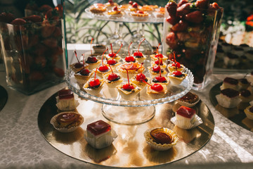 Sweet wedding buffet with different of desserts and fruits.