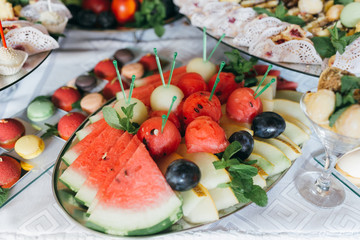 Sweet wedding buffet with different of desserts and fruits.