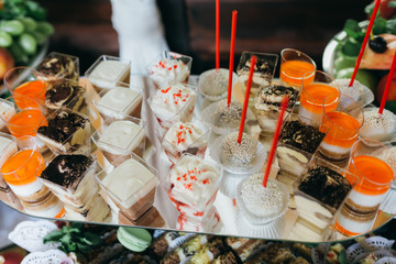 Sweet wedding buffet with different of desserts and fruits.