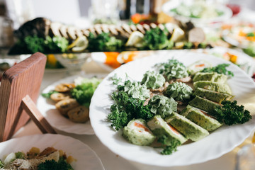 Meat, cheese and nutmeg wedding buffet with various snacks.