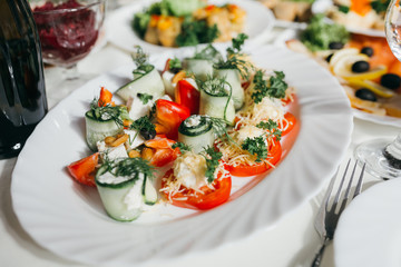 Meat, cheese and nutmeg wedding buffet with various snacks.