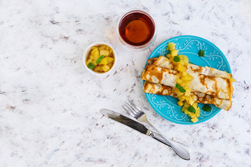 Pancakes with apples on white background