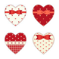 Cute hearts as retro fabric applique with ribbon and bow in shabby chic style