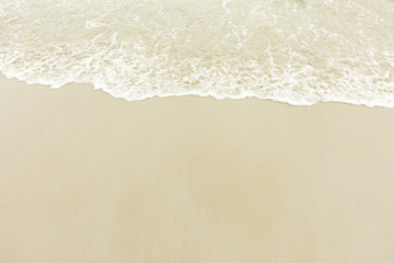 Fototapeta na wymiar Beautiful Soft wave on sandy beach background 