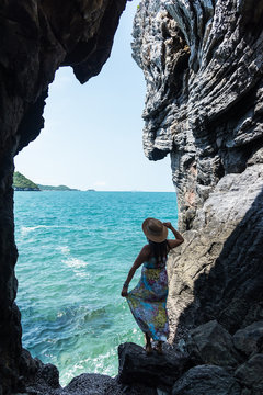 Travel women in a cave near the sea in Keo Sichang,Travel people women tourist in a cave near the sea in Keo Sichang, Thailand. Travel Concept