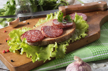 salami and bread on a wooden board